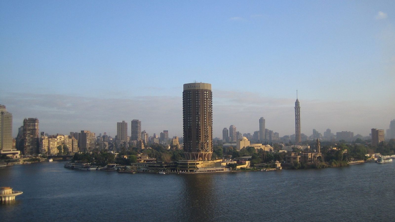 The Cairo skyline along the Nile in the morning, with the Cairo Tower visible among the buildings